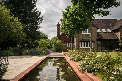 A large new entertaining space with a reflective water feature has replaced the fields.